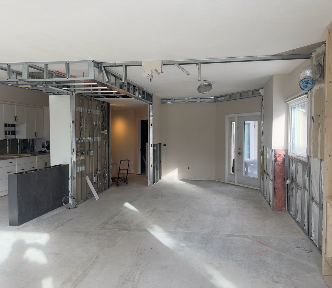 Interior renovation in progress — framing and drywall work by Antrim Construction