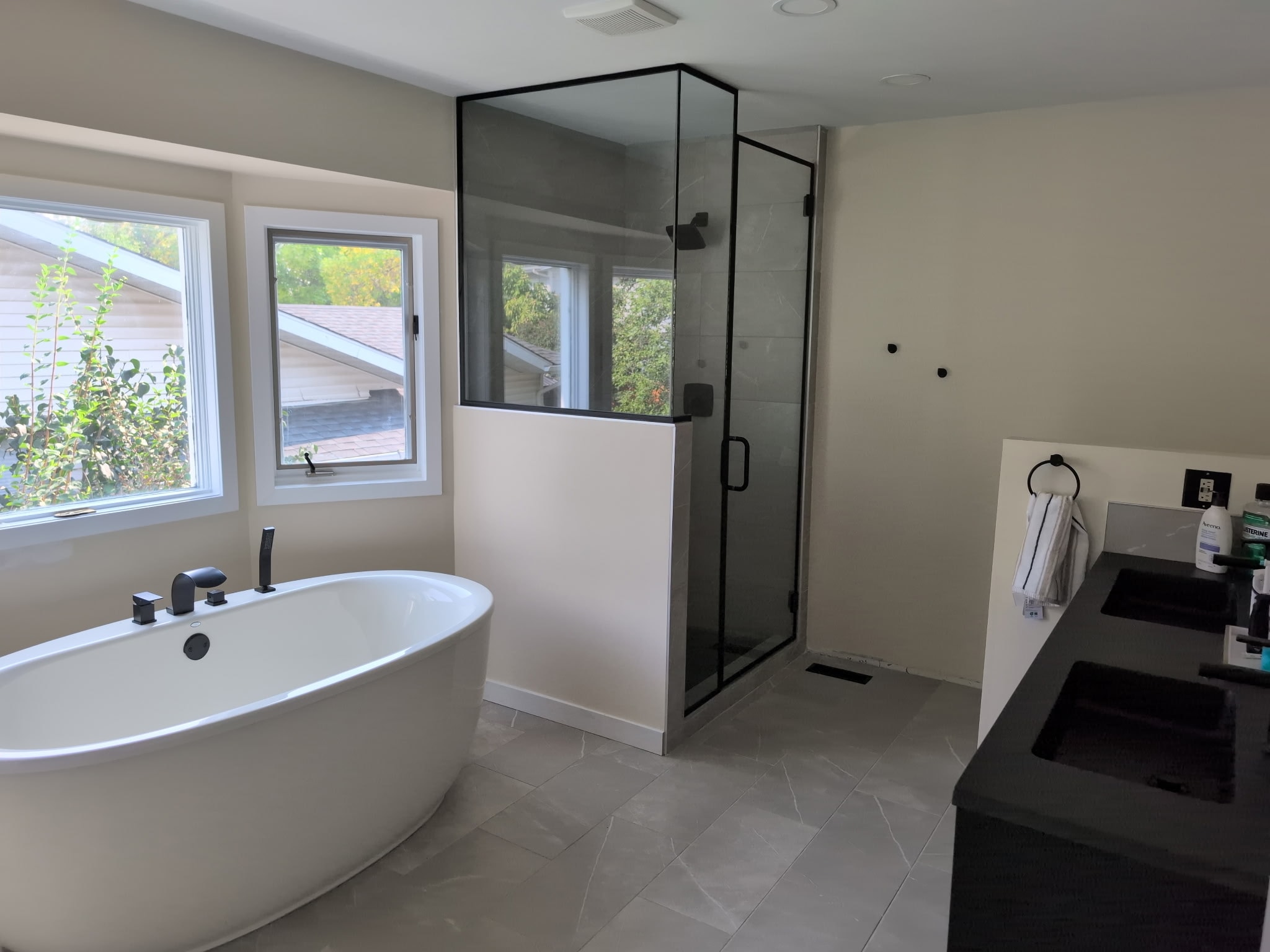 Modern bathroom with soaking tub and shower — Antrim Construction renovation