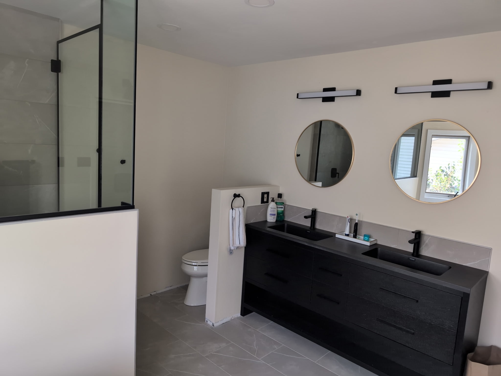 Modern bathroom with double vanity — Antrim Construction completed renovation